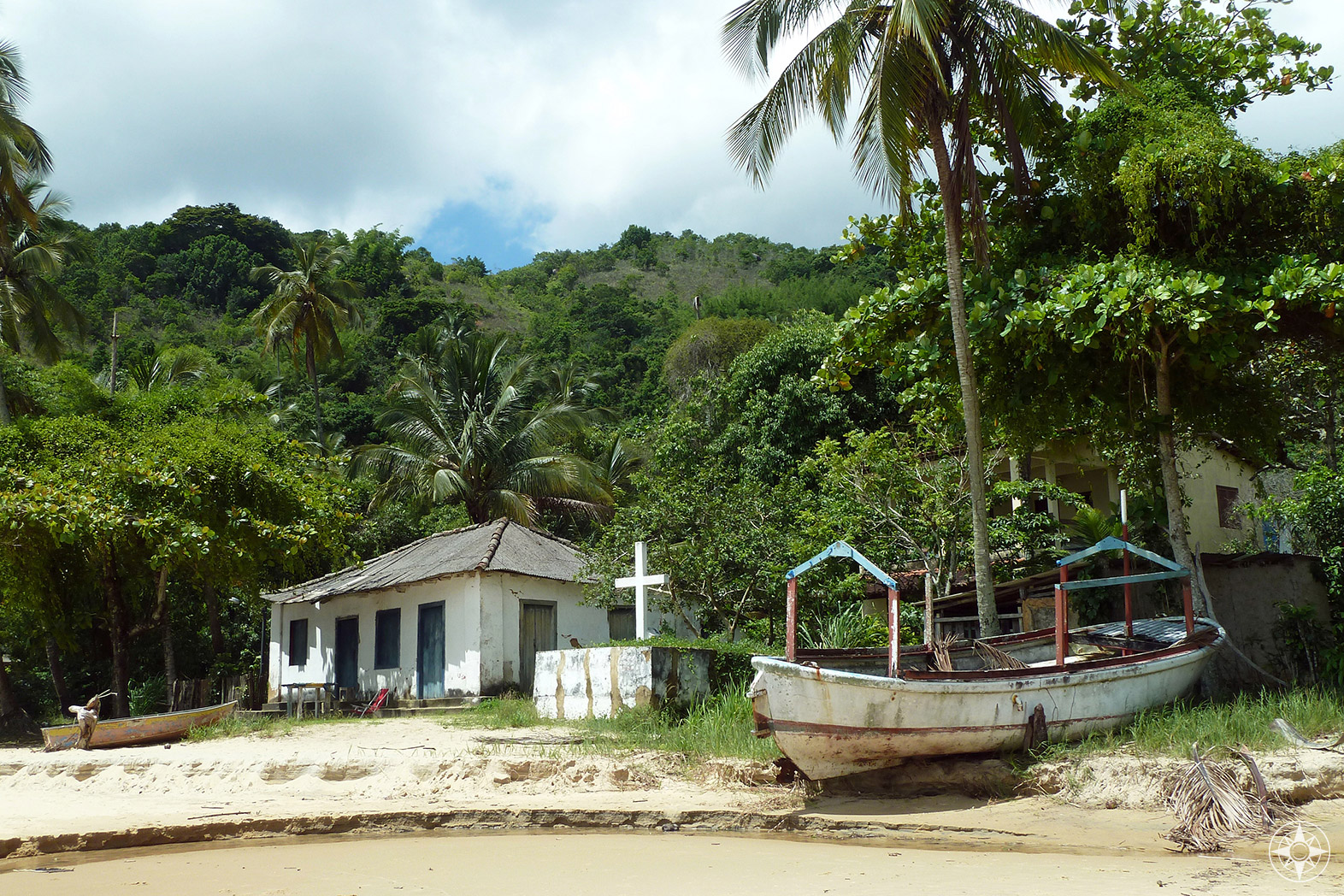 House, cross, boat on a beach - things you find along the jungle-and-beach trail between Vila do Abraão and famous Lopes Mendes beach. HappierPlace