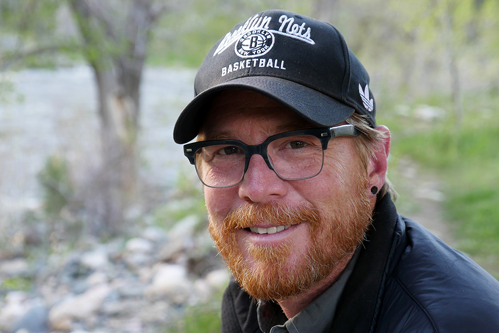 Scott Solary of Happier Place - wearing Brooklyn Nets cap at the Poudre River in Colorado