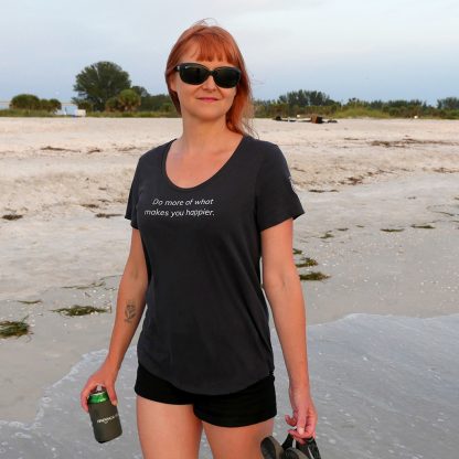 The "Do more of what makes you happier" T-shirt on the beach in Florida at sunset. Happier Place - H011-TSH-HA-GY