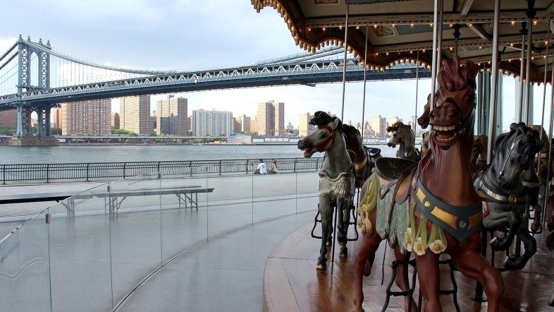 Jane's Carousel in DUMBO, the Manhattan Bridge and the Lower Eastside in Manhattan. Happier Place