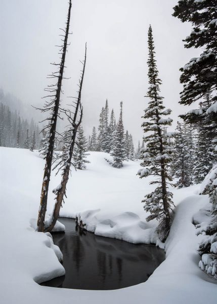 Snow and water in the mountains photographed by Bryan Clark.