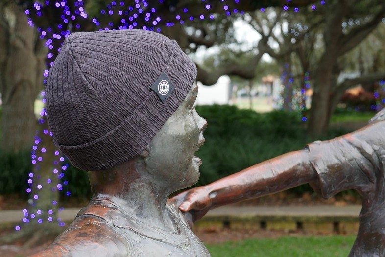 Happier Place Rib Classic Cuffed Beanie on child sculpture in Florida
