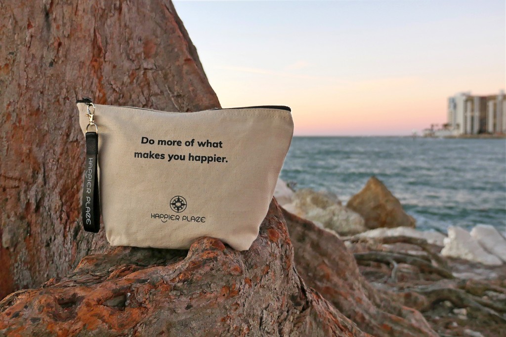 Do more of what makes you happier bag on a tree at Clearwater Beach during sunset