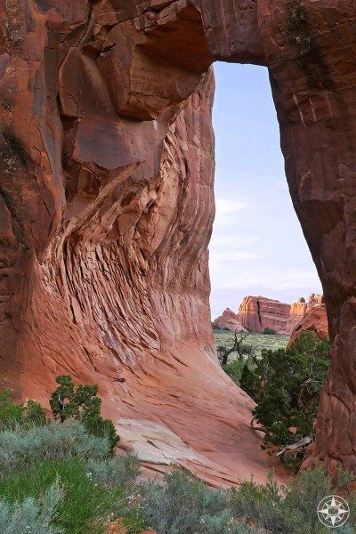 Pinetree Arch in Devils Garden frames the next magnificent view. 