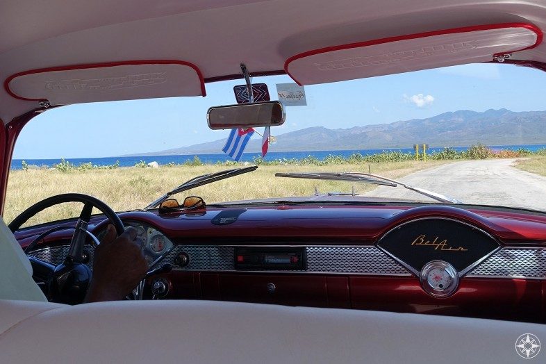 View from a Cuban BelAir classic car taxi of the drive from Playa Ancon to La Boca along the Caribbean Coast.