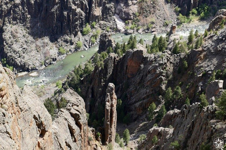 Tall spires and the rushing Gunnison River at the bottom of the Black Canyon