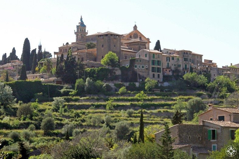 The Charterhouse Monastery of Valldemossa on a green hill on Mallorca.