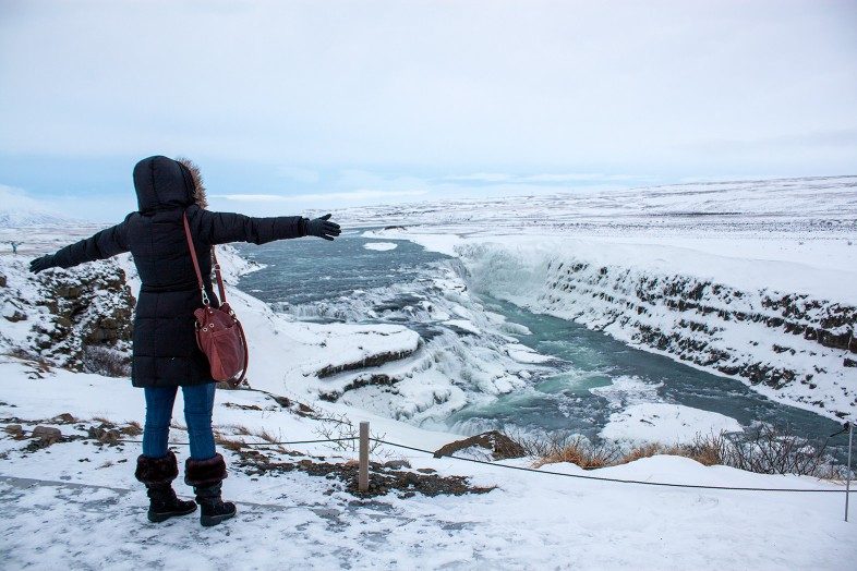 Travel blogger Cheryl Howard at the Gullfoss Waterfall in Iceland.
