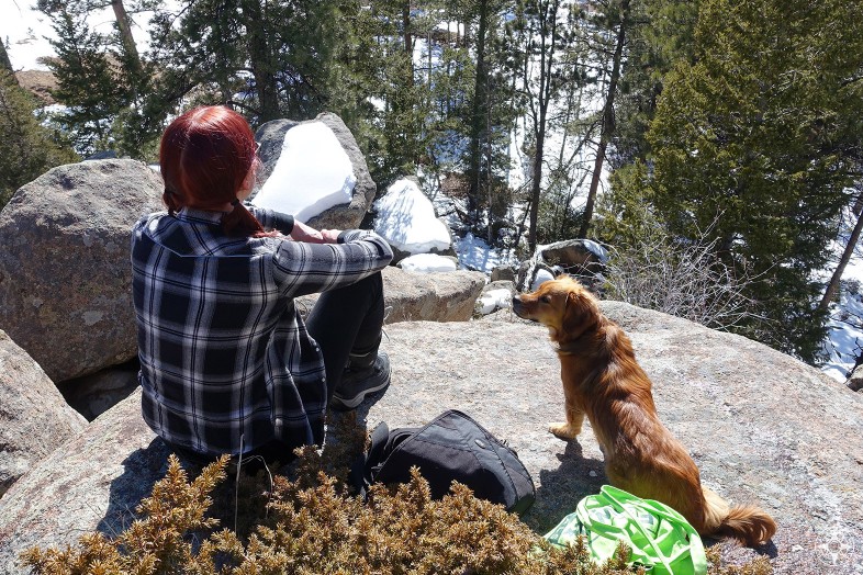 Having a Happier place with dog and woman in the mountains