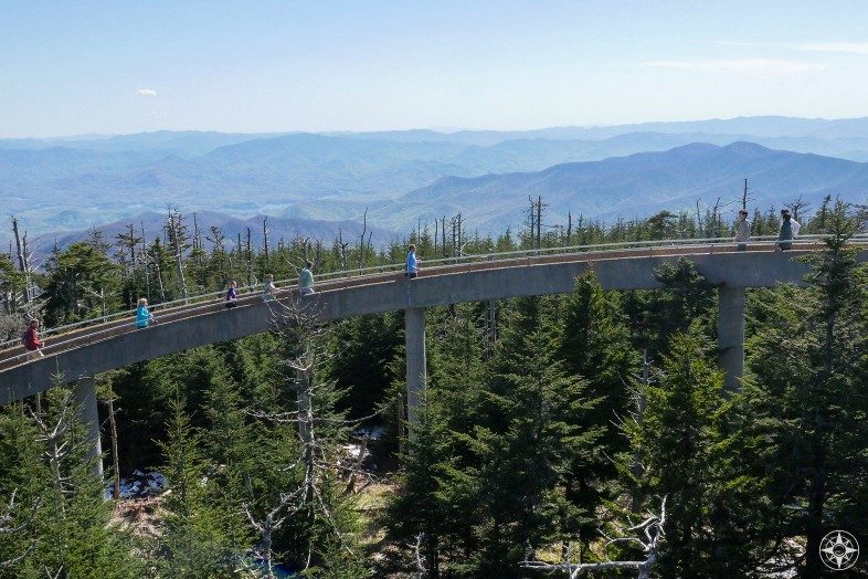People hiking circular ramp up to Clingmans Dome Tower and the Smoky Mountains beyond
