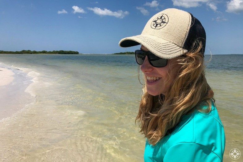 Happier Ambassador Judith on Three Rooker Island in Florida wearing a Happier Place burlap trucker hat