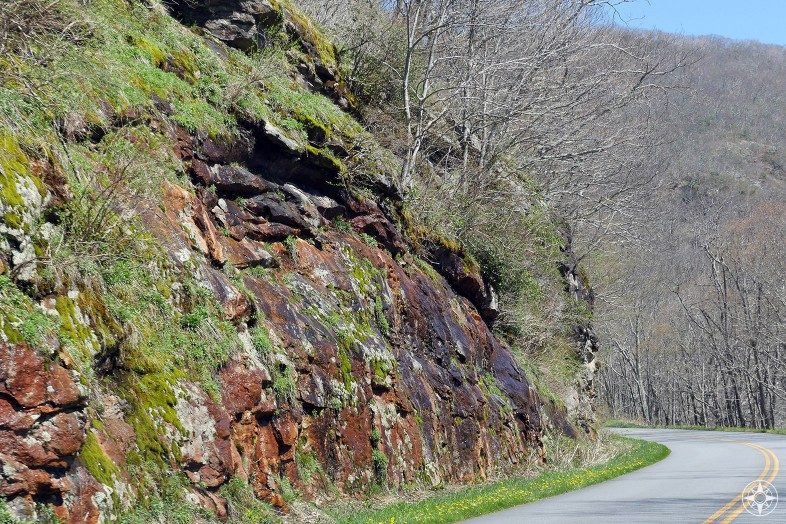 Colorful rock walls covered in lichen and moss, highway, Blue Ridge Parkway, mountains