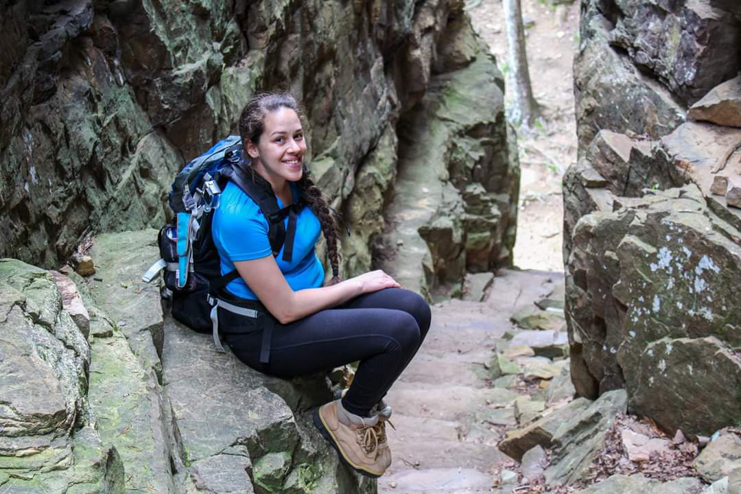Jessica Tejera, The Walking Mermaid, resting along rocky trail