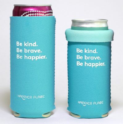 The Happier Place Be Kind Be Brave Be Happier Slim Can Cooler fits 12 oz. and 9 oz. cans. It keeps your slim beverages cool and inspires to be kind, be brave and be happier.