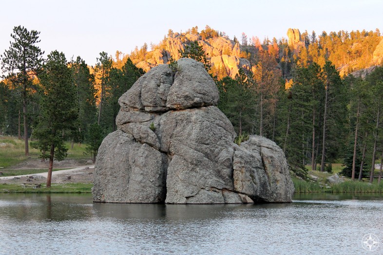 Rocks hugging and kissing during romantic Golden Hour at Sylvan Lake, South Dakota.