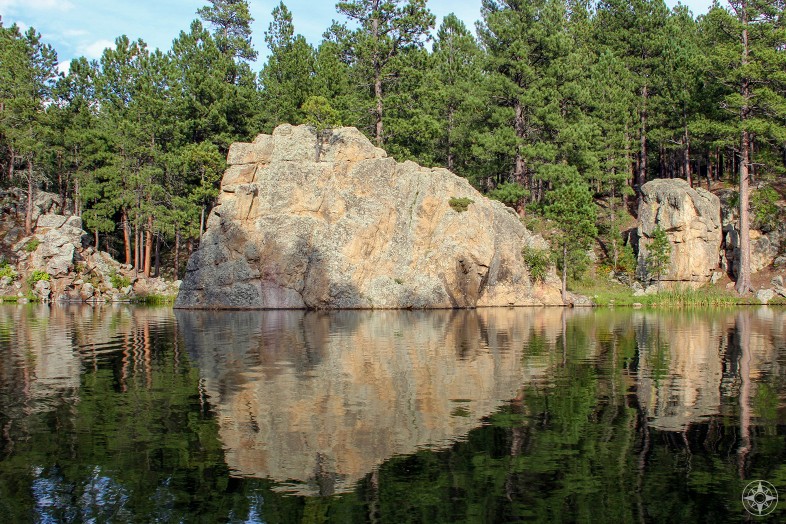 Rock and trees reflection in lake, Custer State Park, Happier Place