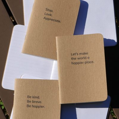 Happier Place books, blank notebooks, with inspiring slogans