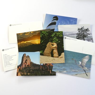 Happier Place postcards featuring outdoor and nature photography, multiple choice cards, kissing prairie dogs, garden of the gods, lighthouse, snow, rocky mountain sunset