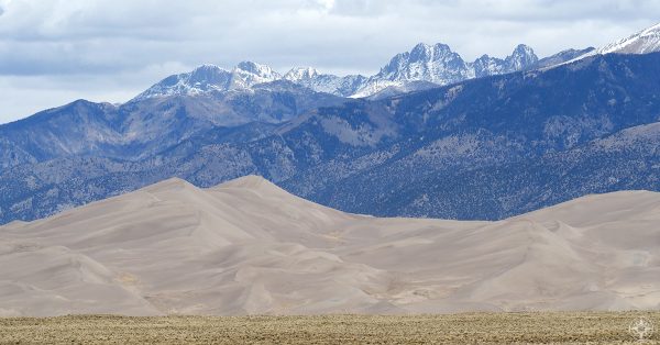 Great Sand Dunes National Park, Colorado, tall sand dunes and snow-peaked mountains