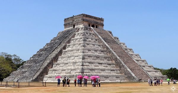 Pink umbrellas before the Wonder of the World, Chichen Itza pyramid El Castillo, Temple of Kukulkan, Yucatan, Mexico, Happier Place