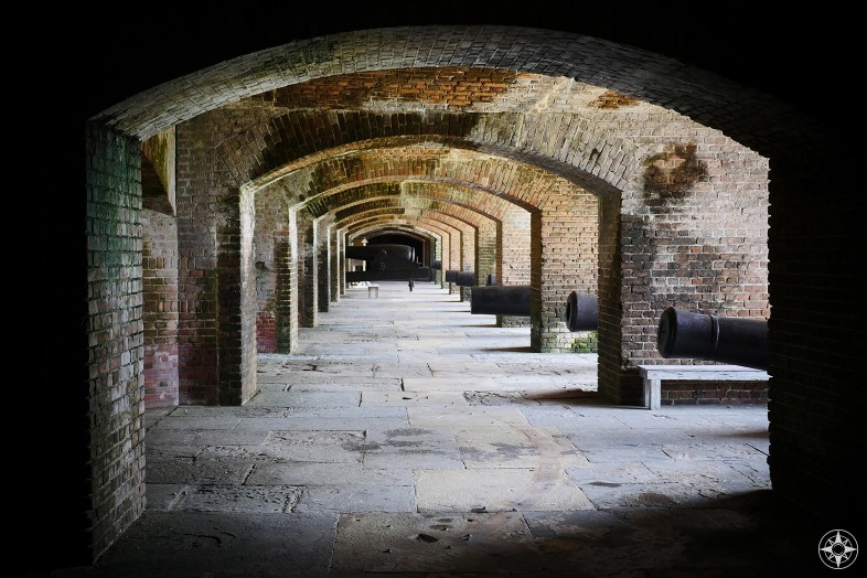 Fort Zachary Taylor canons lined up with windows over the moat