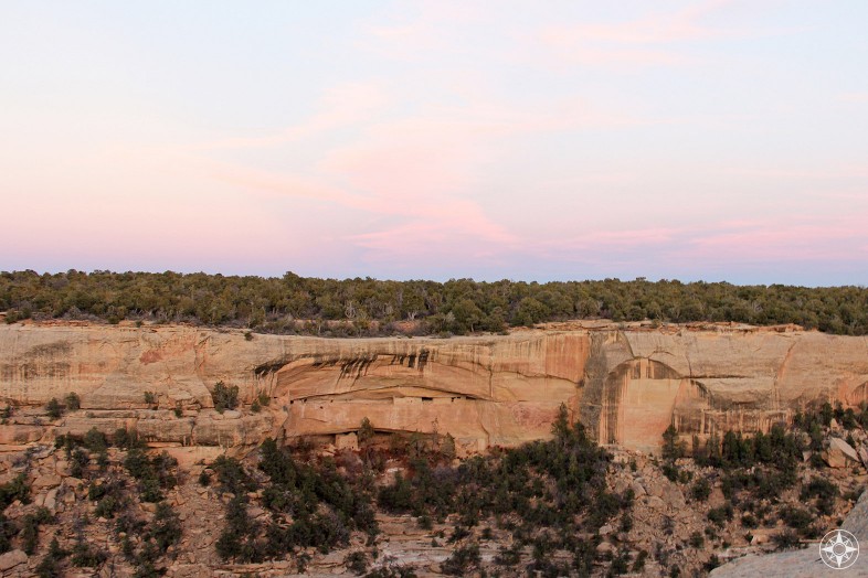 If you didn't know they were there... Ancient Pueblo cliff dwellings in Mesa Verde at sunset.