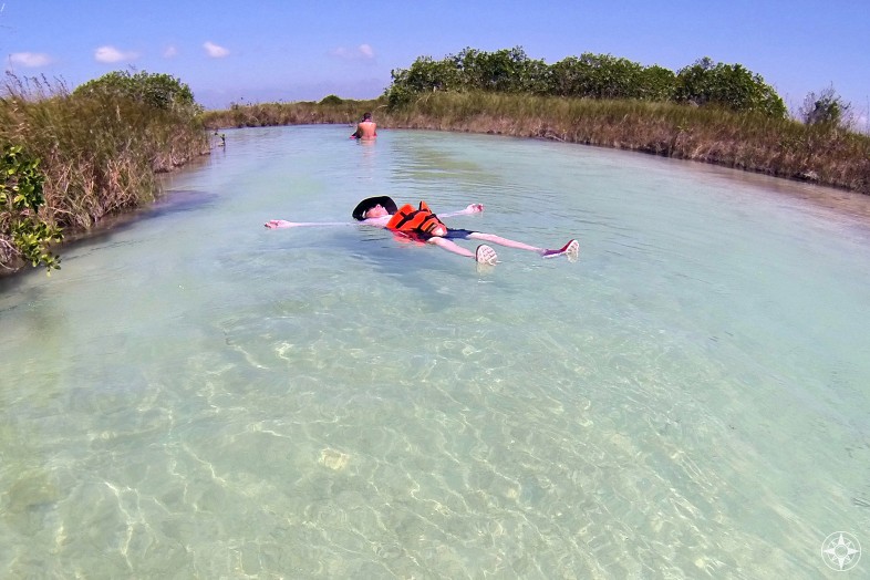 Pure relaxation: floating in the current along a Maya trade canal held up by a life vest.