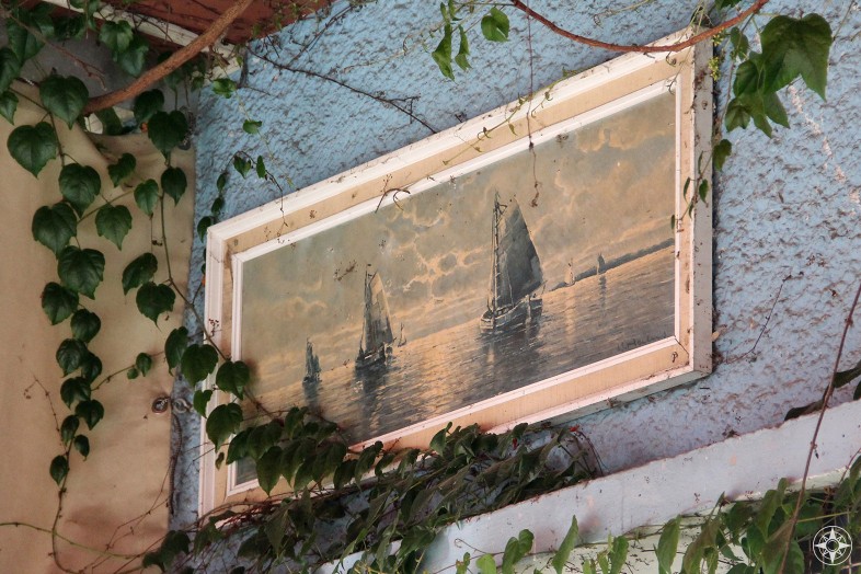 Ivy grows over a sailboat painting. Nature takes back... at Schleusenkrug, a restaurant inside Tiergarten.