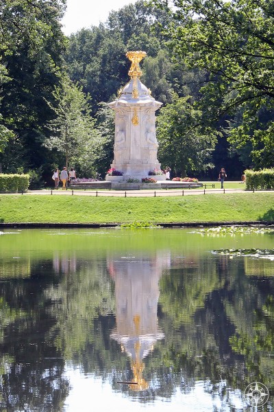 Beethoven-Haydn-Mozart Memorial reflected in a pond in the Tiergarten park.