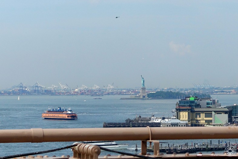 Brooklyn Bridge view of the Staten Island Ferry, Statue of Liberty, harbor, New Jersey