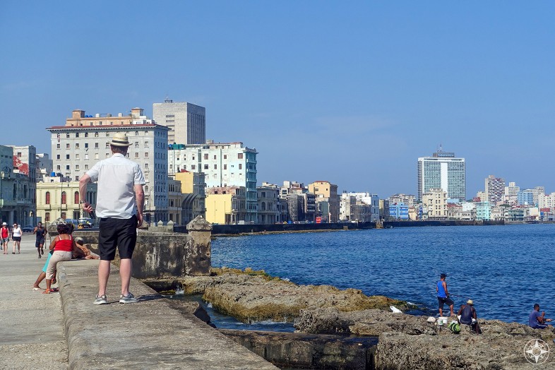 people on the Malecon, sidewalk, new and old sewall, fishing, building, Habana Libre