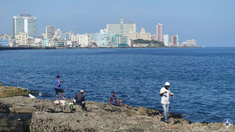 fishing and eating on the old seawall, Malecon, Havana, skyline, Habana Libre, Hotel Nacional
