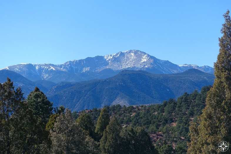America's Mountain: Pikes Peak rises above the woods surrounding Garden of the Gods and Colorado Springs in the Colorado Rocky Mountains