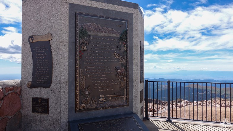 Monument with America the Beautiful lyrics by Katharine Lee Bates on the top of Pikes Peak with the views that inspired the song