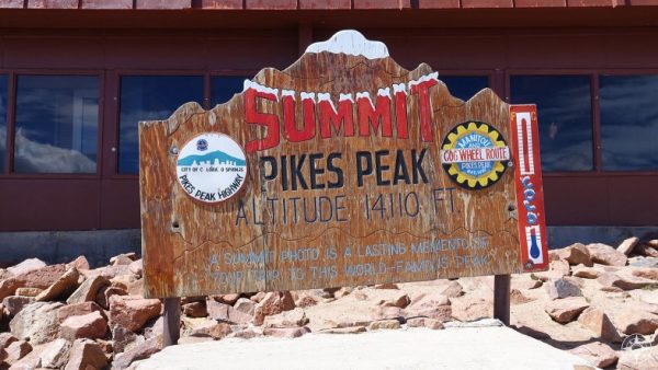 You made it! You're at the 14,110 foot summit - you might as well take a photo. Turns out a photo is a lasting memory.