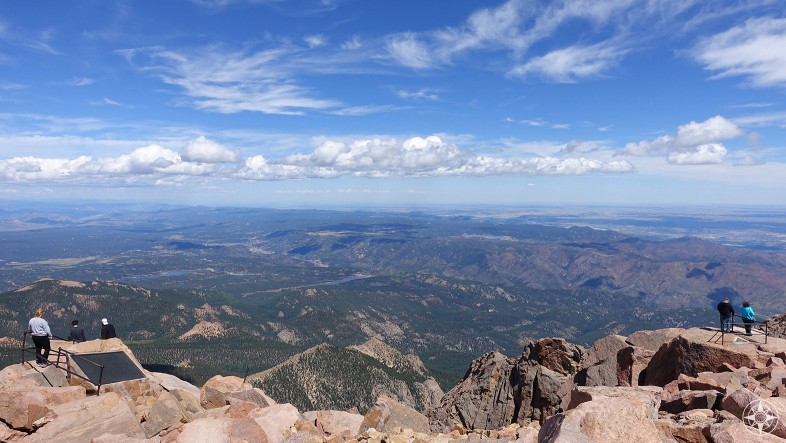 People take in view from Pikes Peak Summit, America's Mountain, Colorado