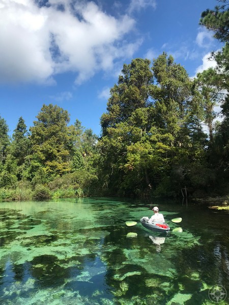 Kayak floating down crystal-clear Weeki Wachee River, Florida