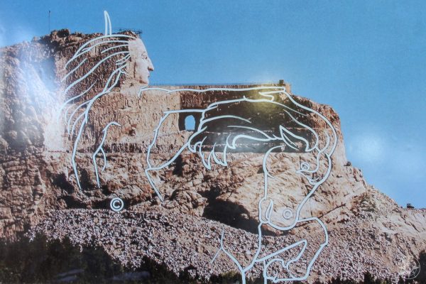 Drawing on a photo showing the planned outlines of Crazy Horse Memorial