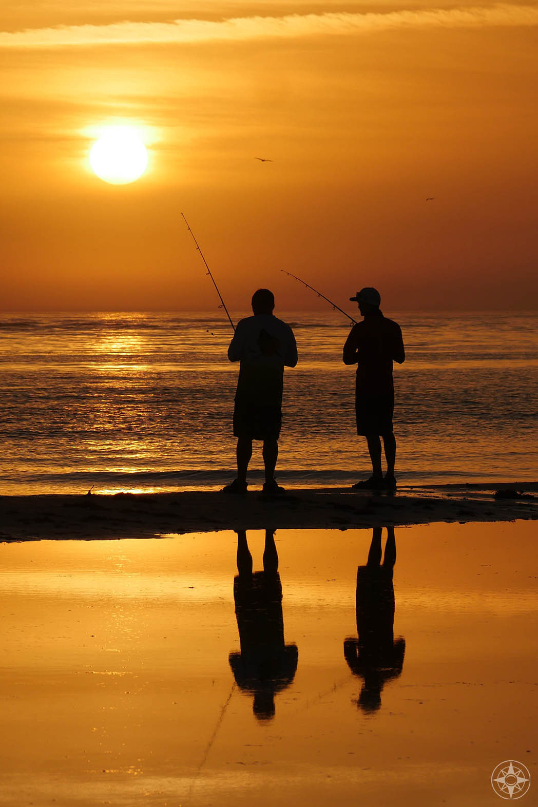 Men fishing, sunset, silhouette, reflection, dog beach, Honeymoon Island, Florida
