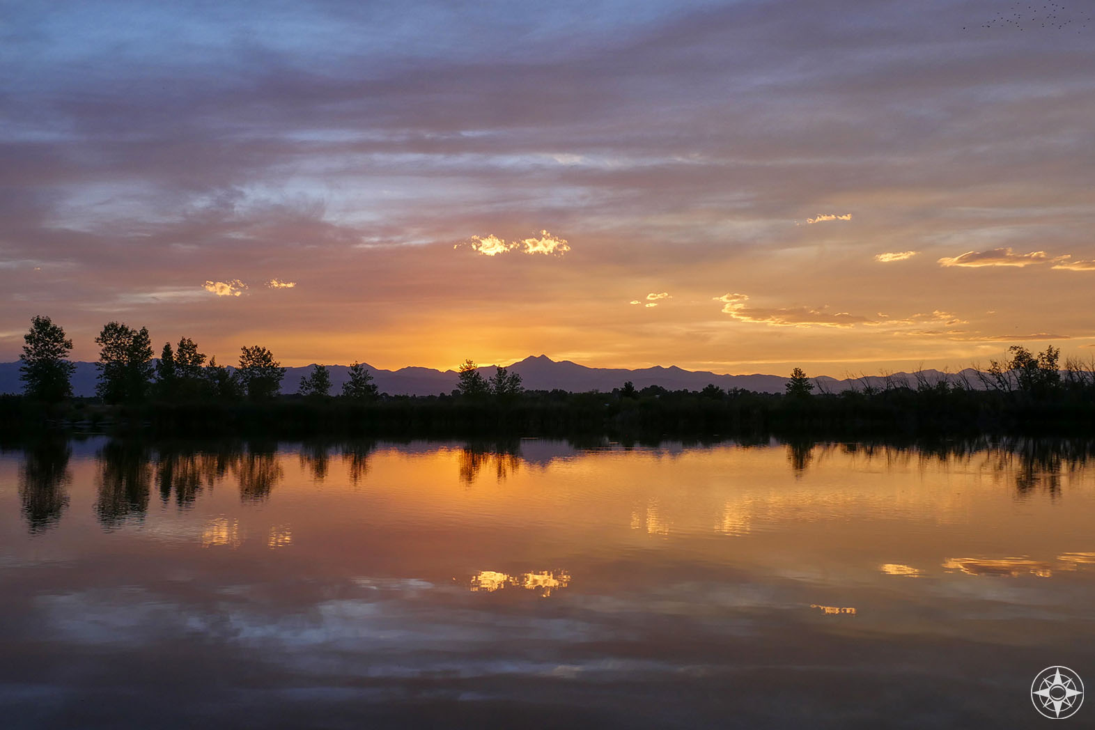 Twilight dusk sunset and Rocky Mountains reflection in Saint Vrain State Park Pond
