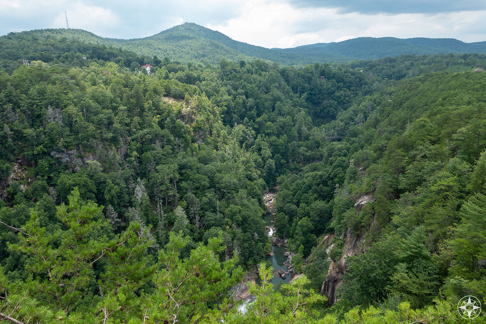 Upstream view of the Tallulah Gorge with the South Rim on the left, the North Rim on the right and the suspension footbridge in the middle 