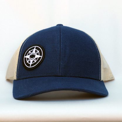Sustainable Hemp Trucker Hat, navy blue and beige, Happier Place compass logo, cotton, recycled polyester