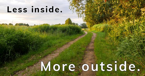Less inside. More outside. trail between trees and fields during golden hour, Happier Place slogan to get happier and healthier,