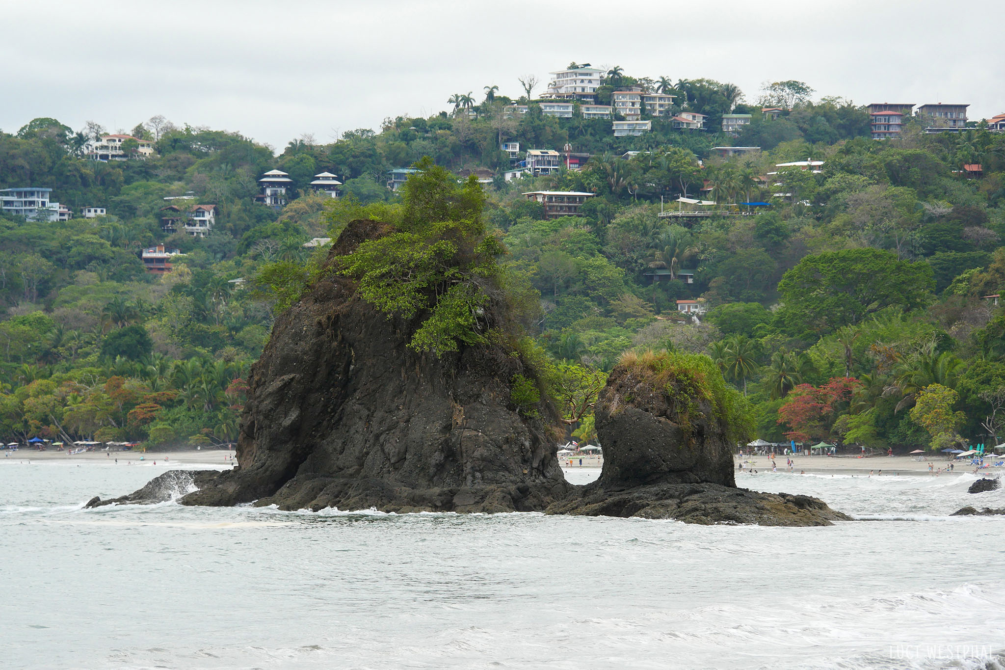 As the shoreline continues north, the town and hostels and rentals near Manuel Antonio National Park come into view as they hug the coastal hills